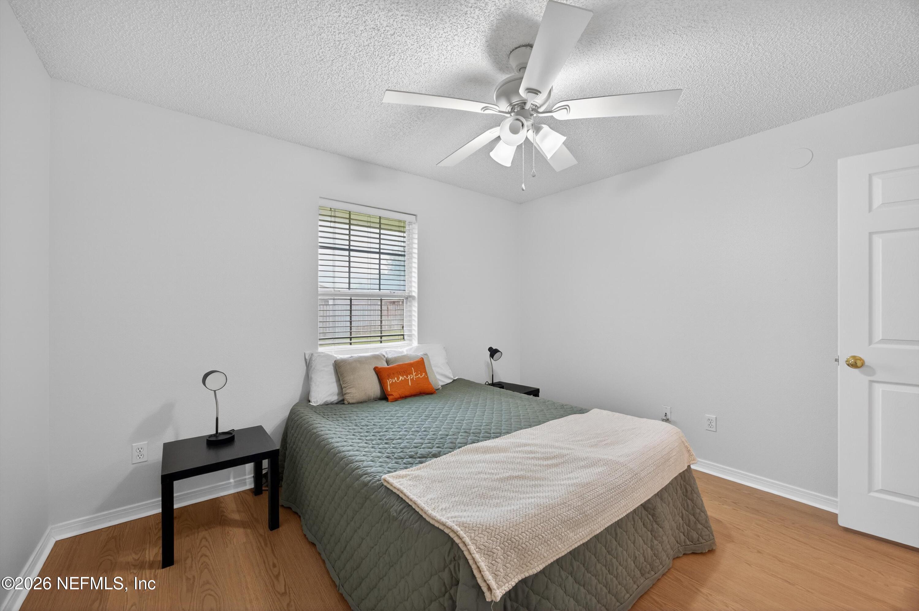 2411 Paris Mill Road Jacksonville, FL 32221 - Photo 8 of 36 a bedroom with a bed and window