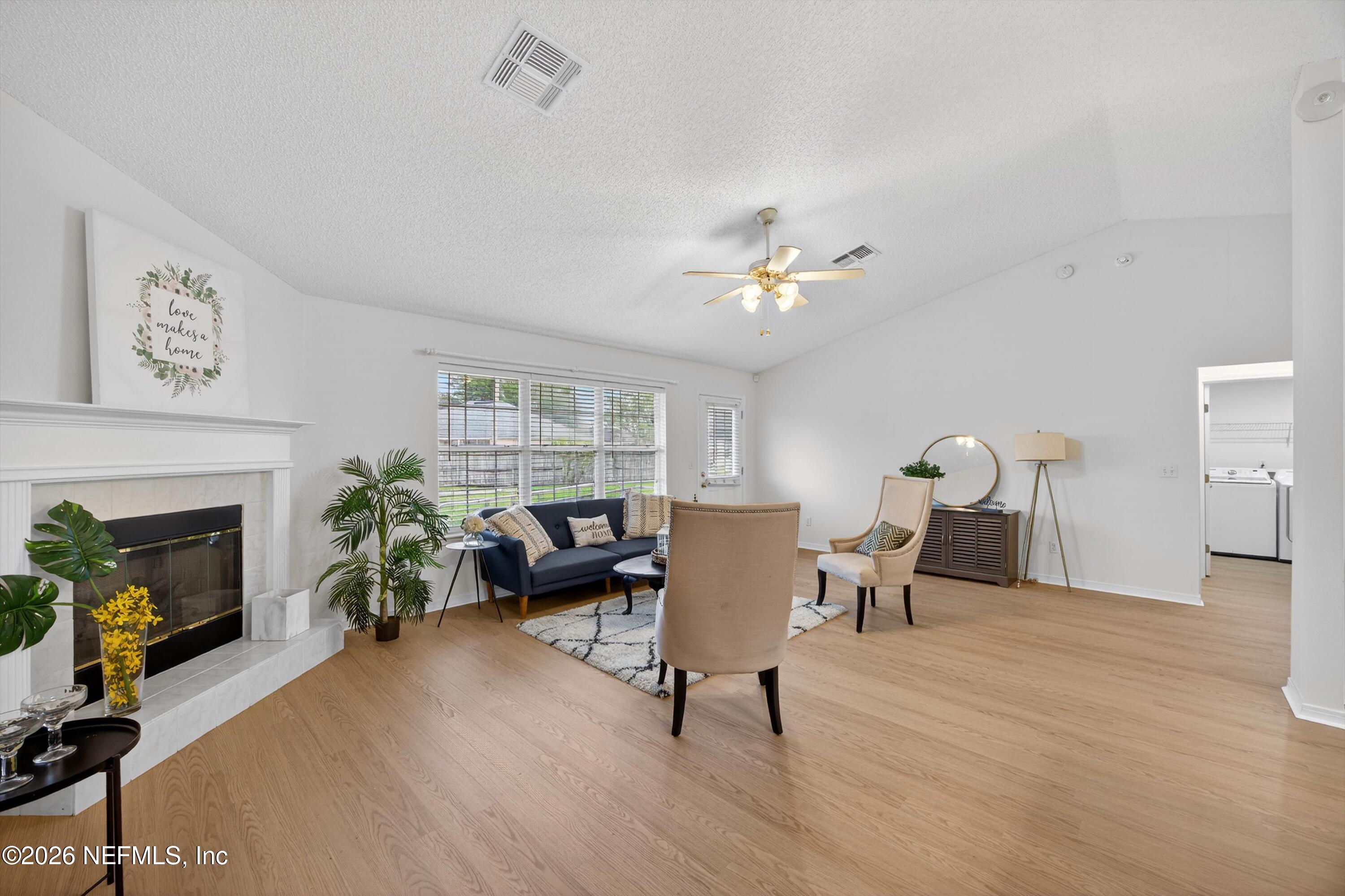2411 Paris Mill Road Jacksonville, FL 32221 - Photo 10 of 36 a living room with furniture and a fireplace