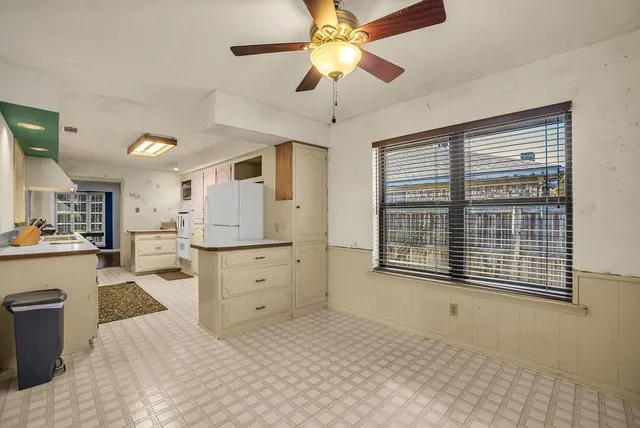 a view of a kitchen with furniture and a window