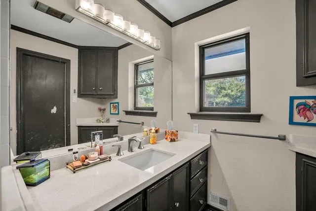 a kitchen with a sink stove and refrigerator