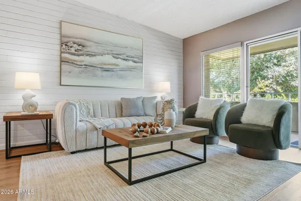 a living room with furniture and a large window