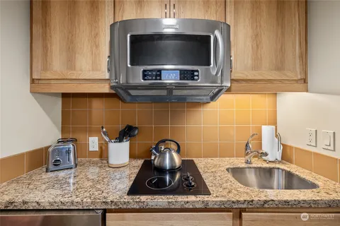 a kitchen with a stove and a microwave