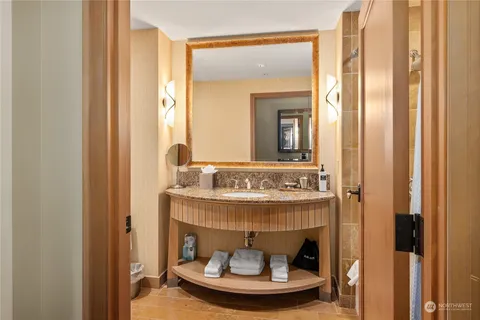 a bathroom with a mirror and a sink