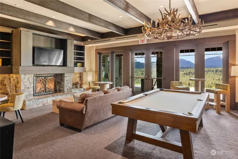 a view of a livingroom with furniture window and wooden floor
