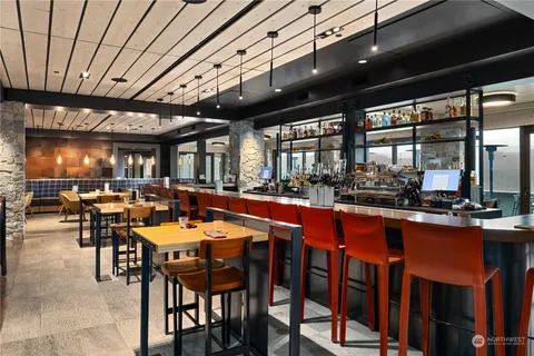 a group of people sitting at tables in a room