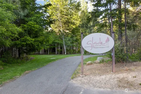 a view of a table and chairs in the back yard