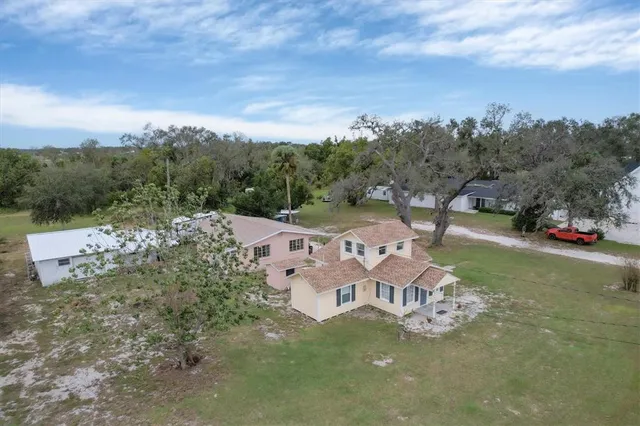 an aerial view of a house with a garden