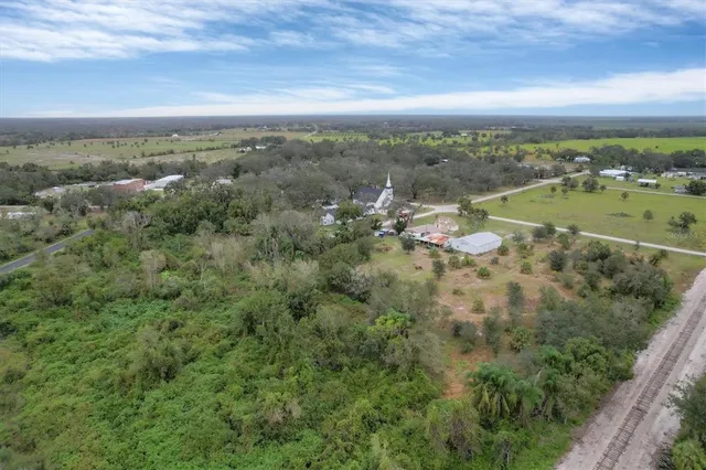 an aerial view of residential building and trees