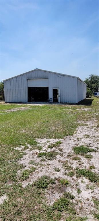 9548 Southwest Falcon Avenue Arcadia, FL 34269 - Photo 44 of 47 a backyard of a house