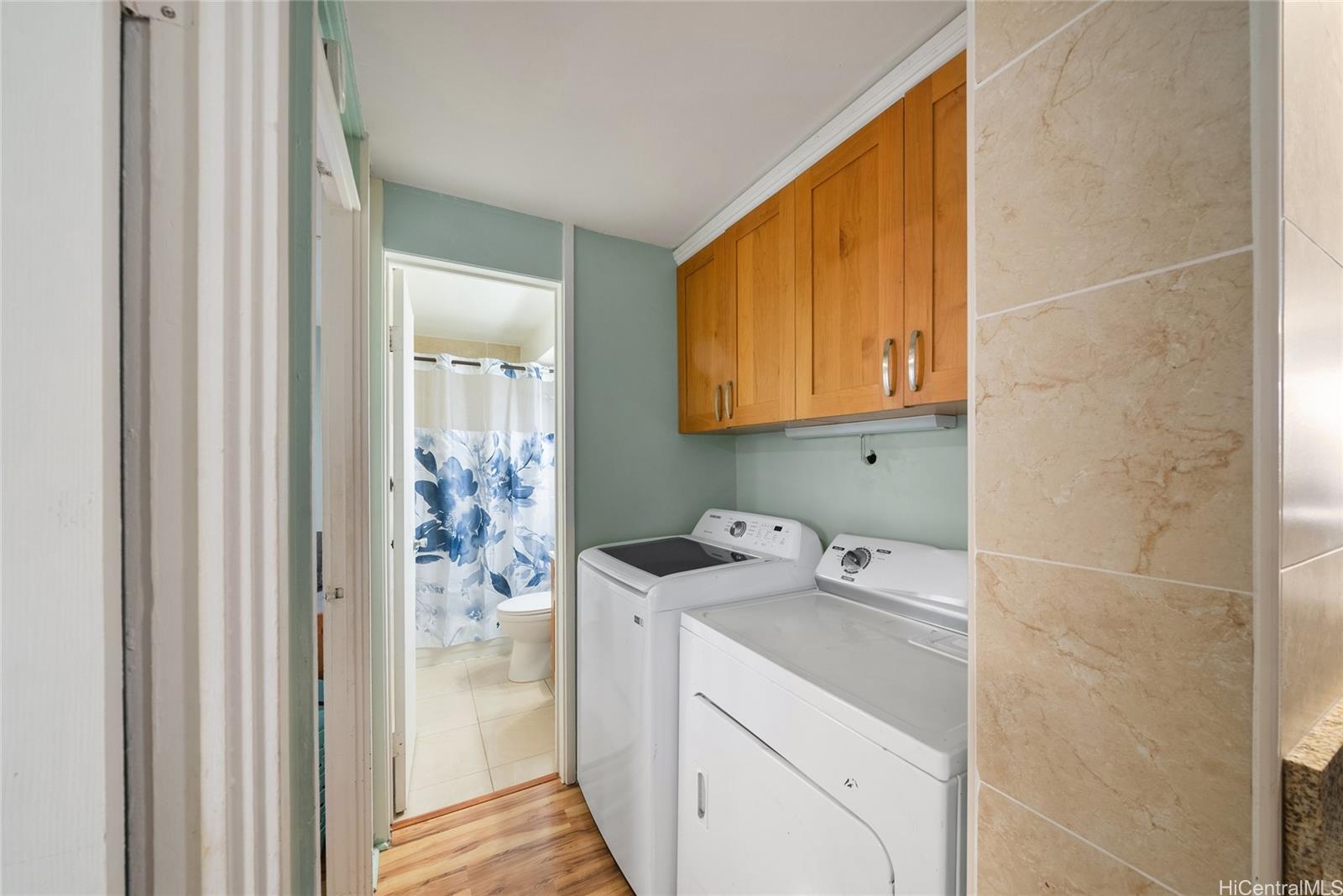 3215 Ala Ilima Street, Unit A510 Honolulu, HI 96818 - Photo 8 of 14 a bathroom with a sink a washer and dryer