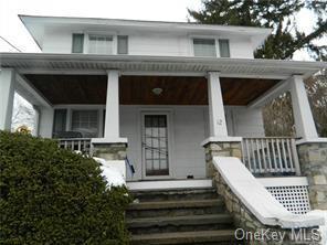 12 South Plank Road Newburgh, NY 12550 - Photo 1 of 1 View of front of property featuring a porch and stone siding