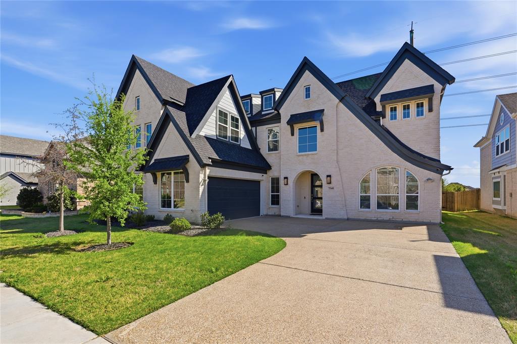 7548 Ridge Lane Grand Prairie, TX 75054 - Photo 1 of 35 French country home with concrete driveway and brick siding