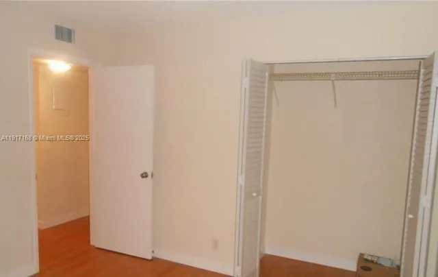 a view of house with yard and outdoor seating