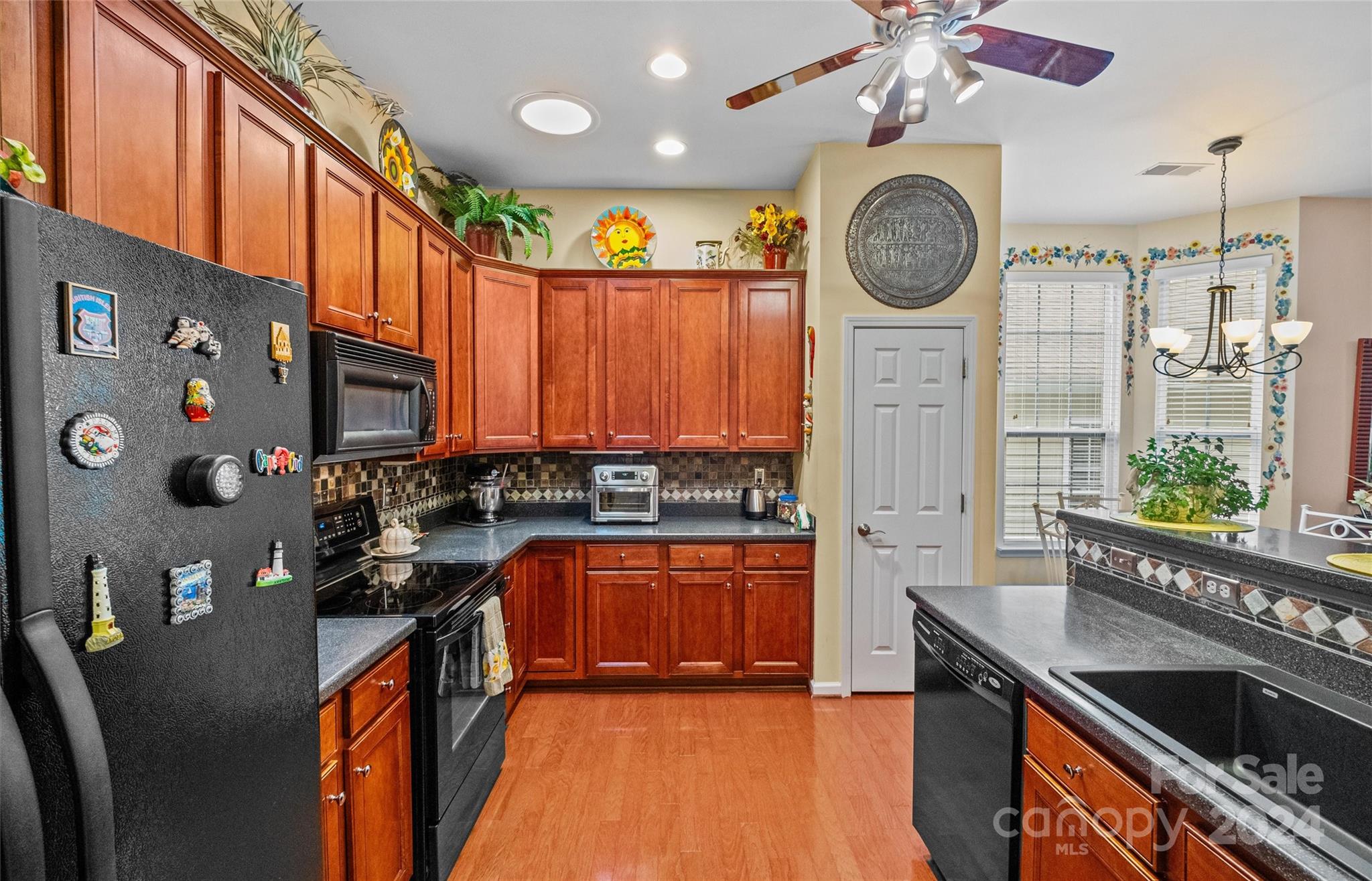978 Platinum Drive Fort Mill, SC 29708 - Photo 18 of 48 a kitchen with stainless steel appliances granite countertop a stove a sink and a refrigerator