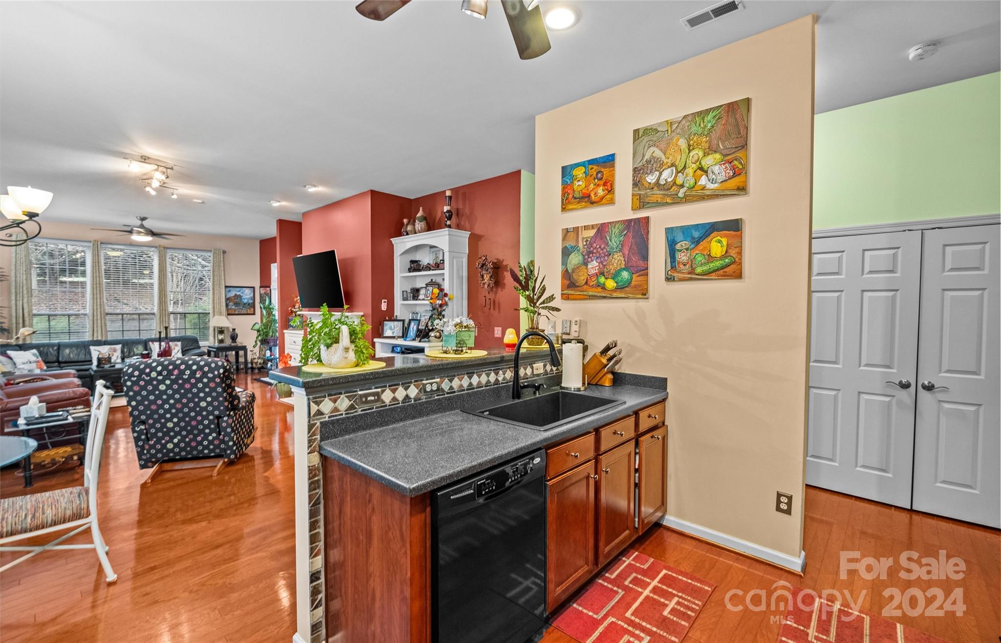 978 Platinum Drive Fort Mill, SC 29708 - Photo 20 of 48 a kitchen that has a lot of cabinets a sink and wooden floor