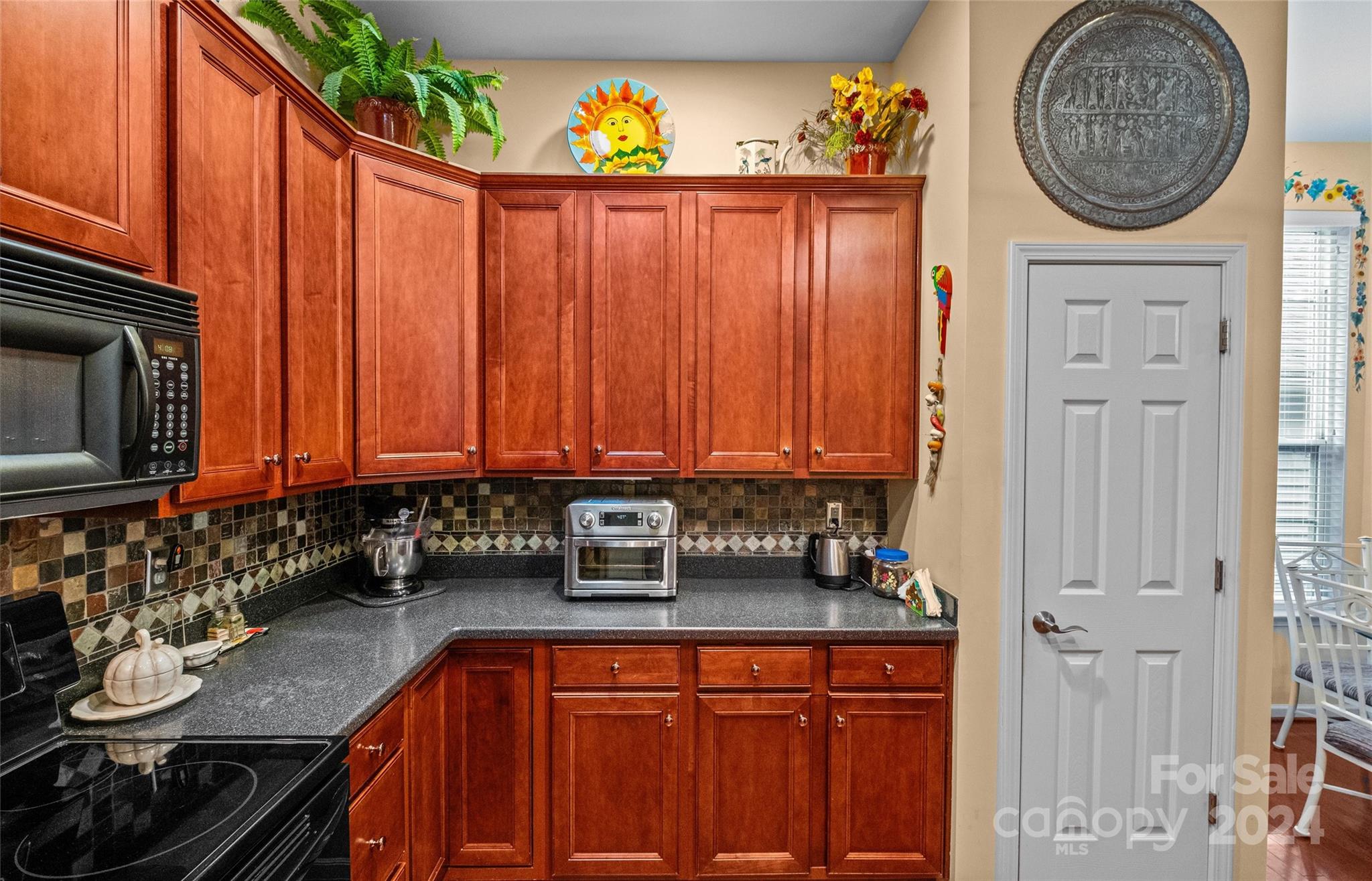 978 Platinum Drive Fort Mill, SC 29708 - Photo 23 of 48 a kitchen with stainless steel appliances a stove a sink and a microwave