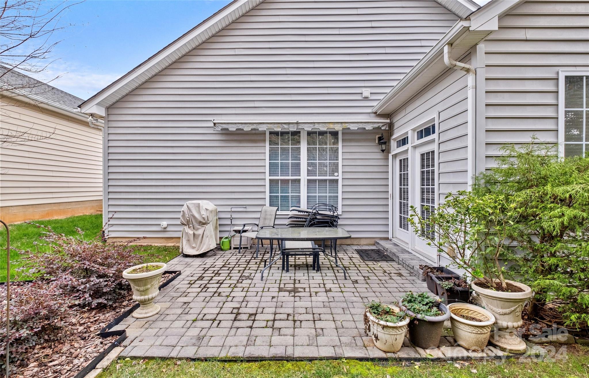 978 Platinum Drive Fort Mill, SC 29708 - Photo 32 of 48 a view of a patio with chairs and potted plants