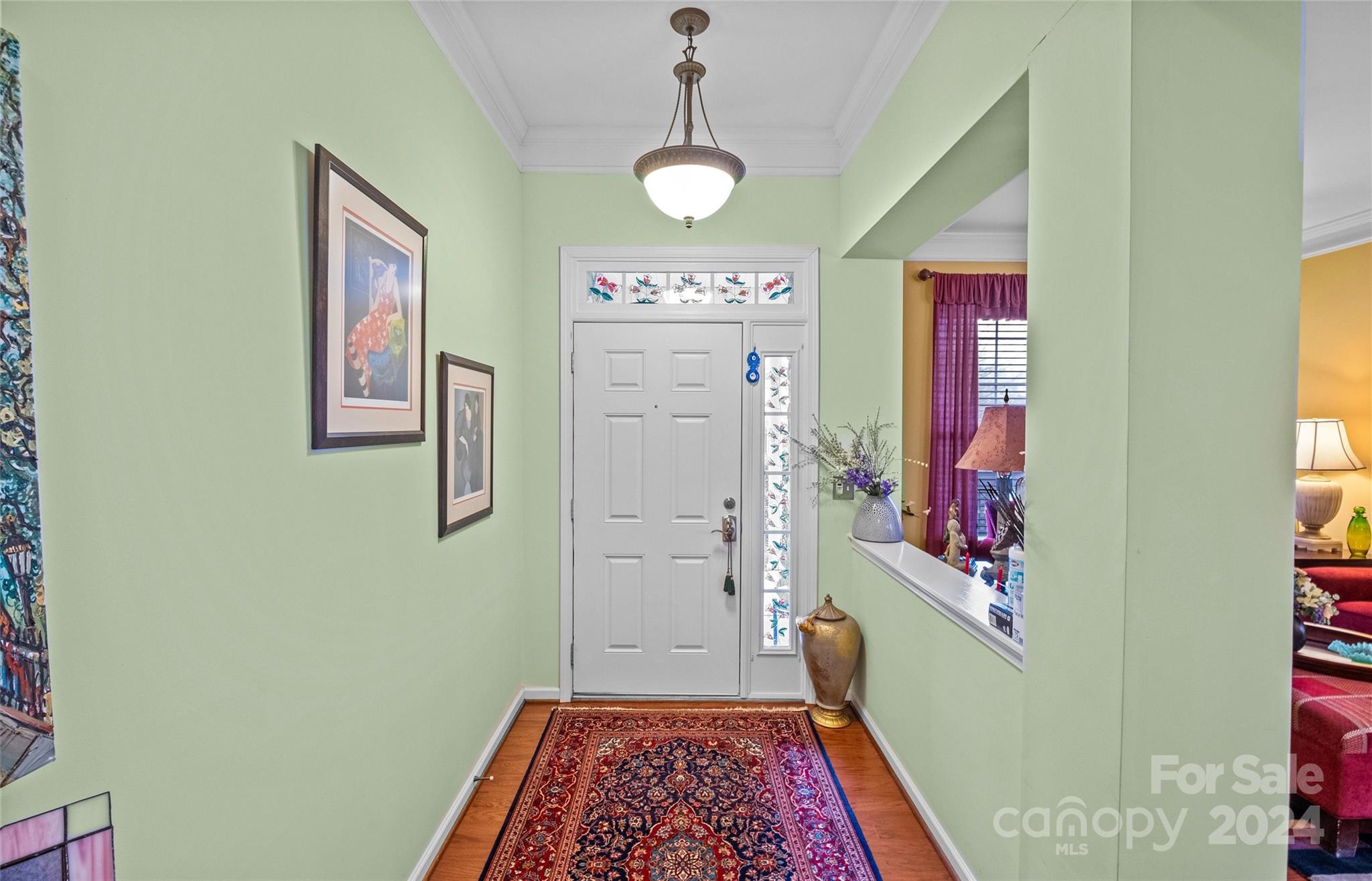 978 Platinum Drive Fort Mill, SC 29708 - Photo 5 of 48 a hallway with painting on the wall and a rug