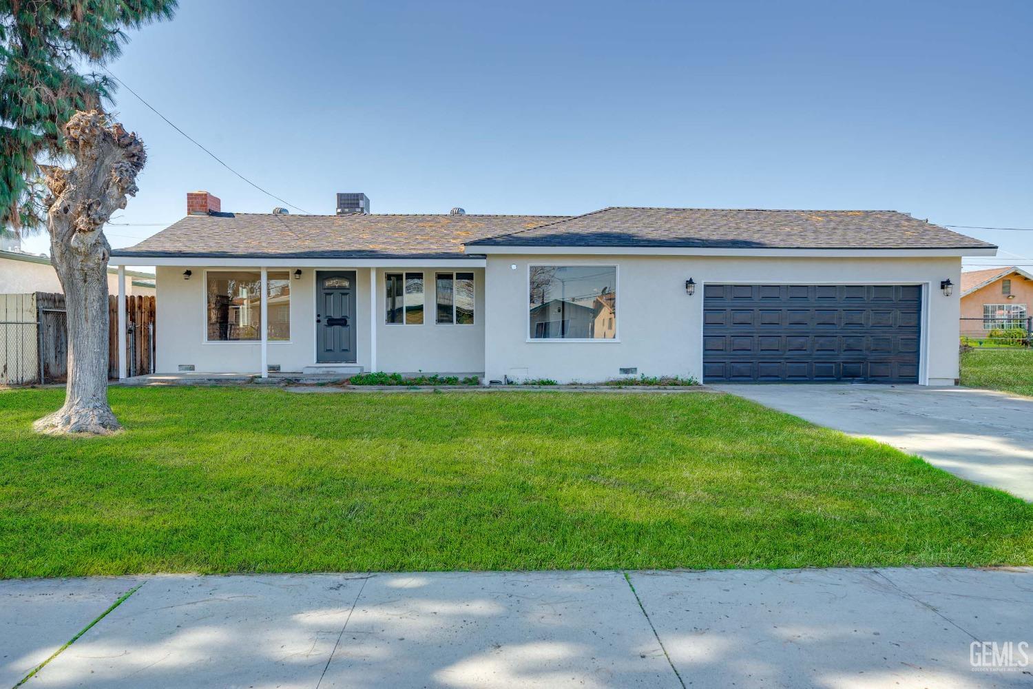 Undisclosed Address Bakersfield, CA 93304 - Photo 1 of 1 front view of house with a yard
