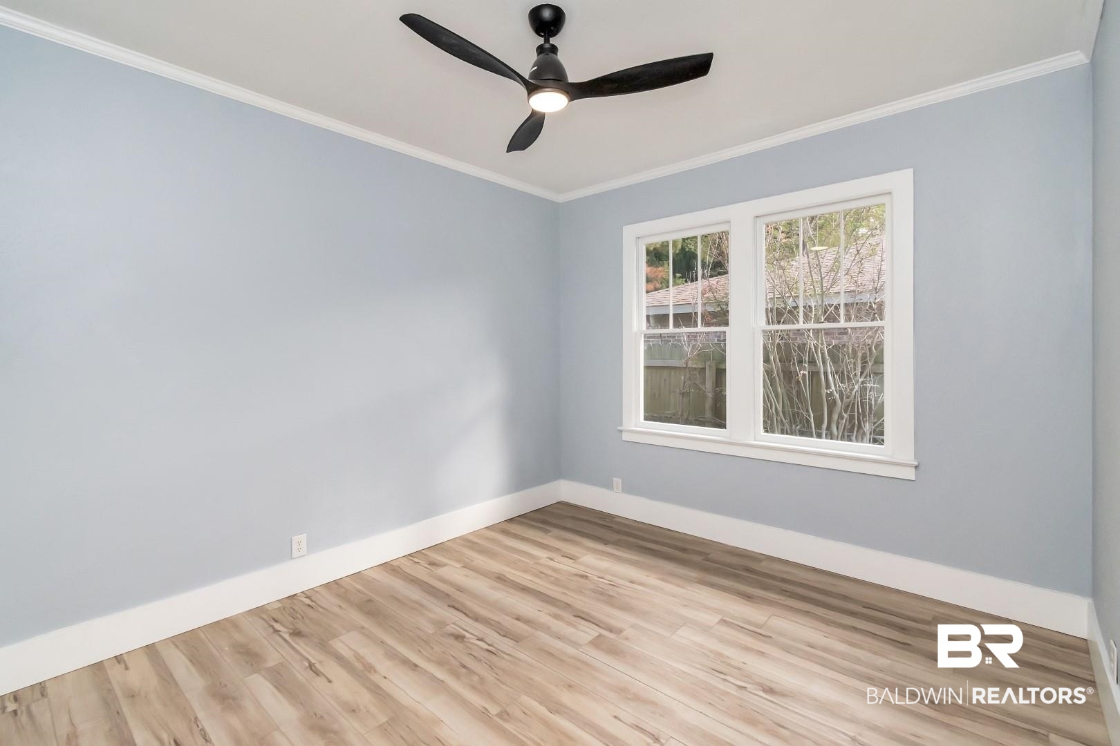 555 Michigan Avenue Mobile, AL 36604 - Photo 23 of 28 Empty room with ceiling fan, light hardwood / wood-style flooring, and ornamental molding