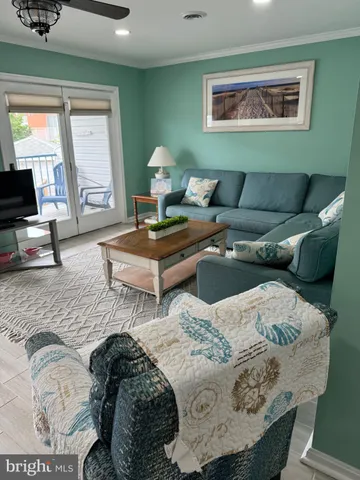 a living room with furniture and window