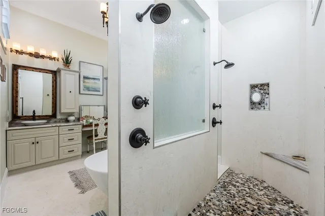 a bathroom with a tub sink and mirror