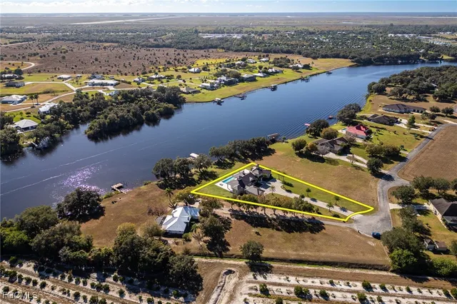 an aerial view of lake residential house with outdoor space