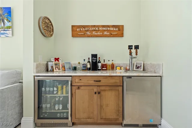 a view of cabinets a washer and dryer