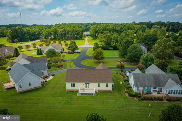 an aerial view of a house with a swimming pool
