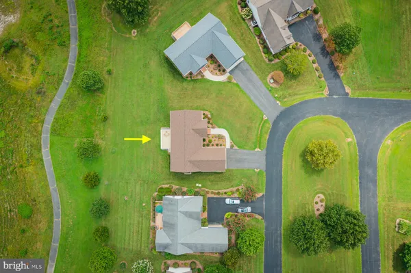 an aerial view of a house with outdoor space