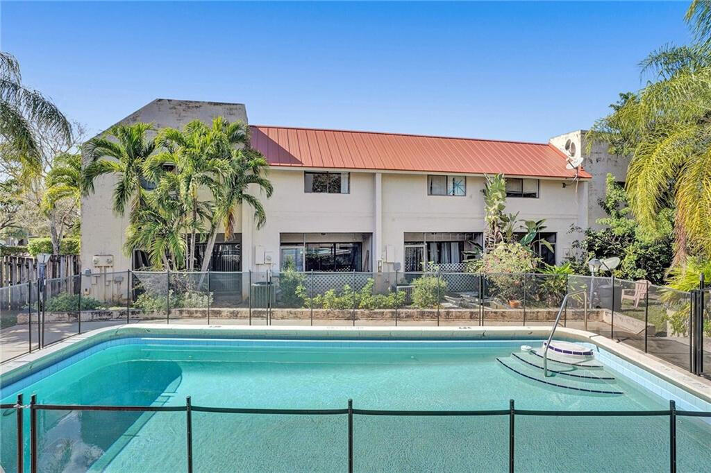 1679 Northwest 15th Vista Boca Raton, FL 33432 - Photo 1 of 15 a view of a house with a swimming pool