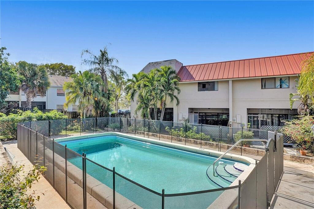 1679 Northwest 15th Vista Boca Raton, FL 33432 - Photo 2 of 15 a swimming pool with outdoor seating and yard