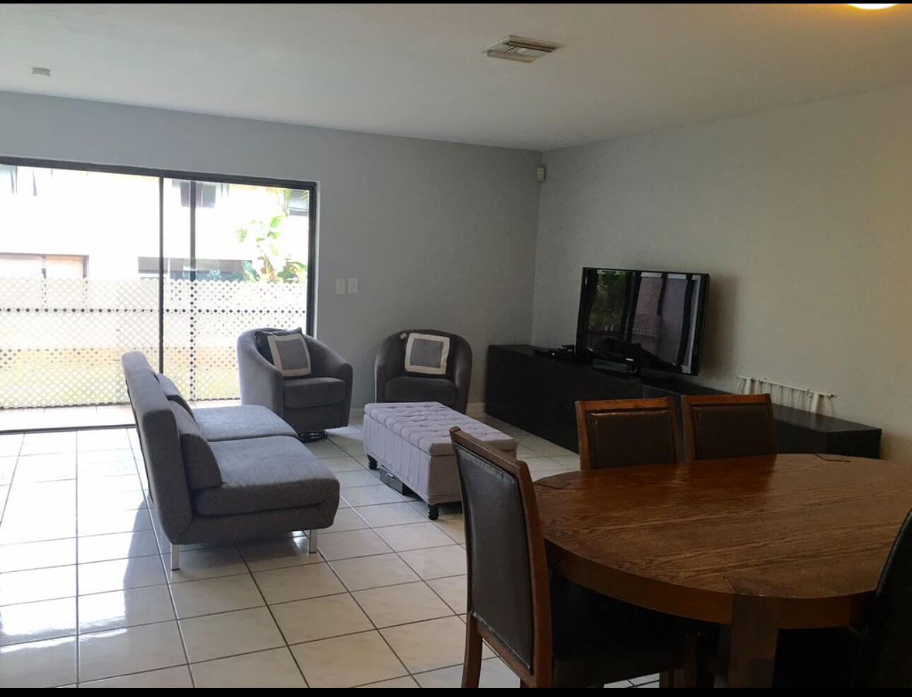 1679 Northwest 15th Vista Boca Raton, FL 33432 - Photo 6 of 15 a living room with furniture and a large window