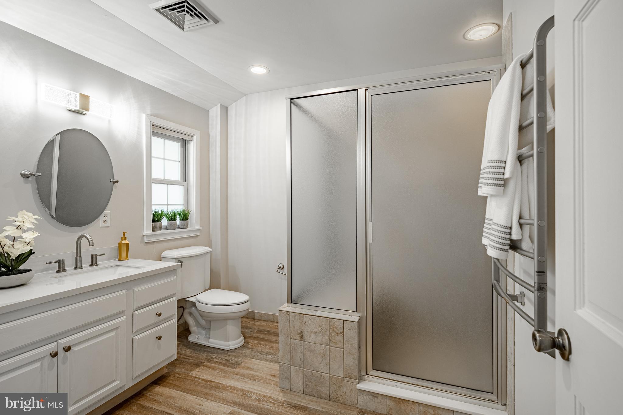 466 Barclay Road Bryn Mawr, PA 19010 - Photo 34 of 62 a bathroom with a double vanity sink toilet mirror and shower