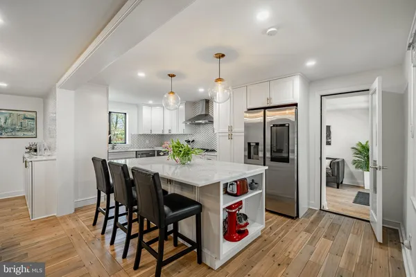 a view of a chairs and table in the balcony