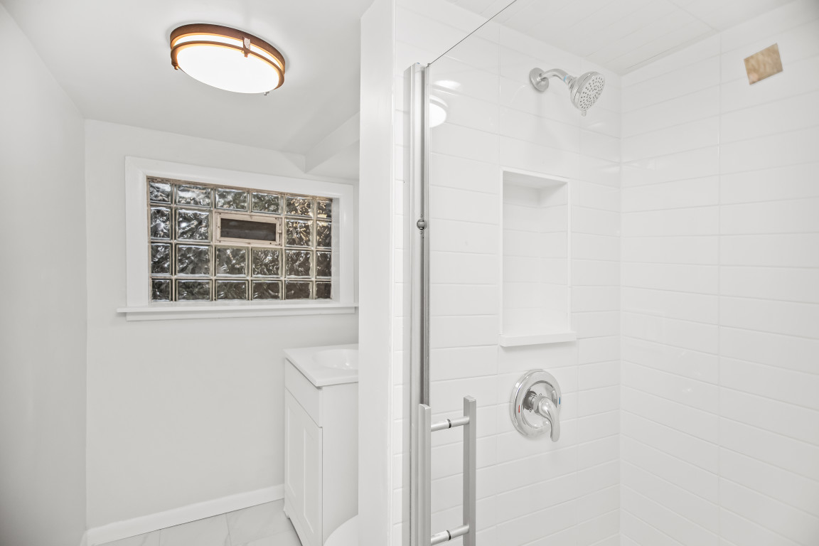 1808 Laurel Avenue Evanston, IL 60201 - Photo 11 of 15 a bathroom with a window and a shower