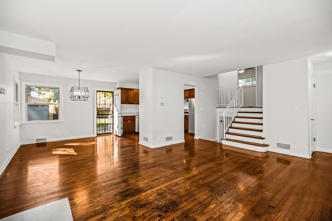 1808 Laurel Avenue Evanston, IL 60201 - Photo 3 of 15 an empty room with wooden floor and windows