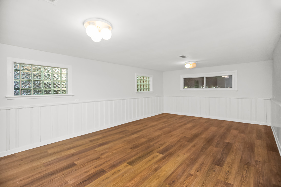1808 Laurel Avenue Evanston, IL 60201 - Photo 10 of 15 an empty room with wooden floor and windows