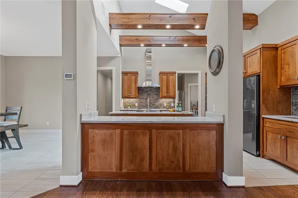 a bathroom with a sink a mirror and shower