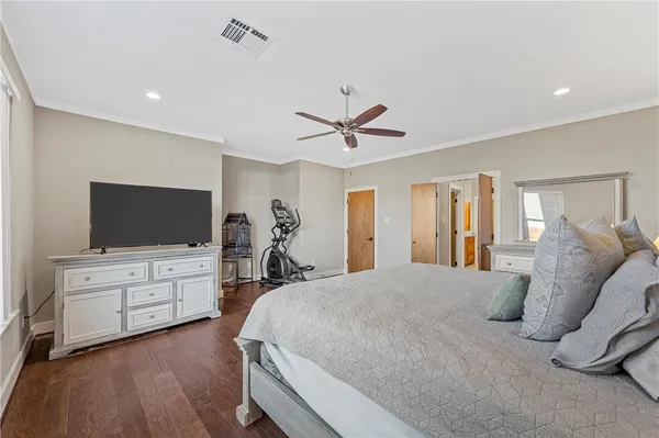 a bed room with furniture and flat screen tv