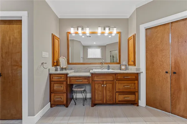 a bathroom with a double vanity sink and a mirror