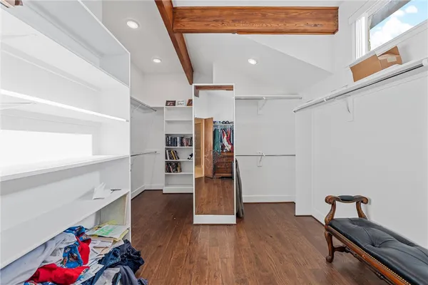 a view of entryway with stairs and wooden floor