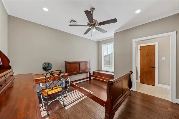 a living room with furniture a flat screen tv and a window