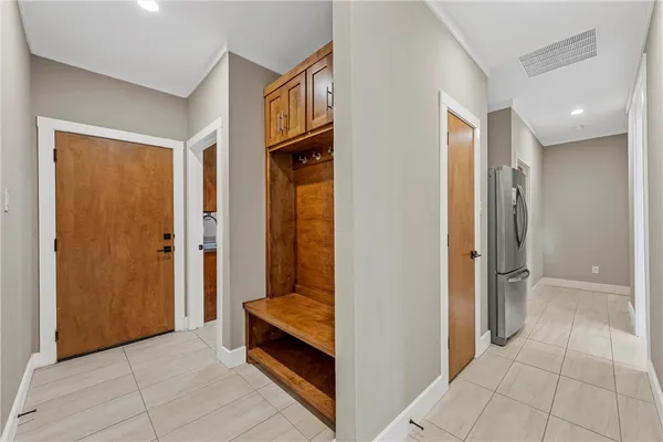 a view of a room with furniture and front door