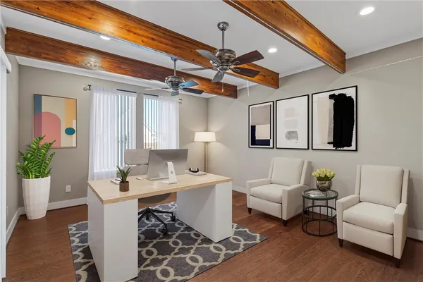 a living room with furniture a ceiling fan and a window
