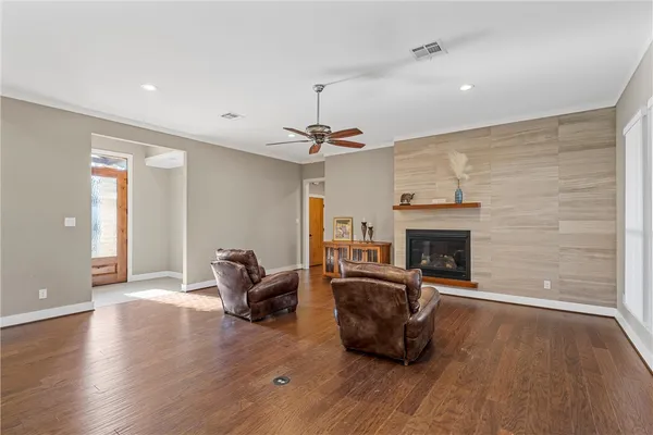 a living room with furniture and a fireplace