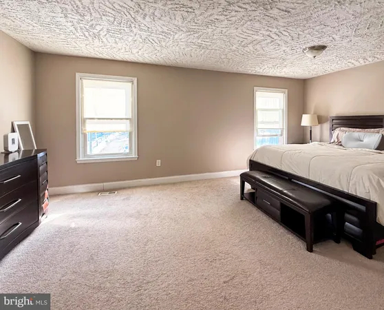 a bed room with a bed and a window