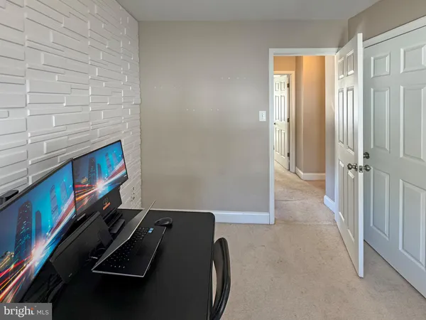 a view of an empty room and fire place