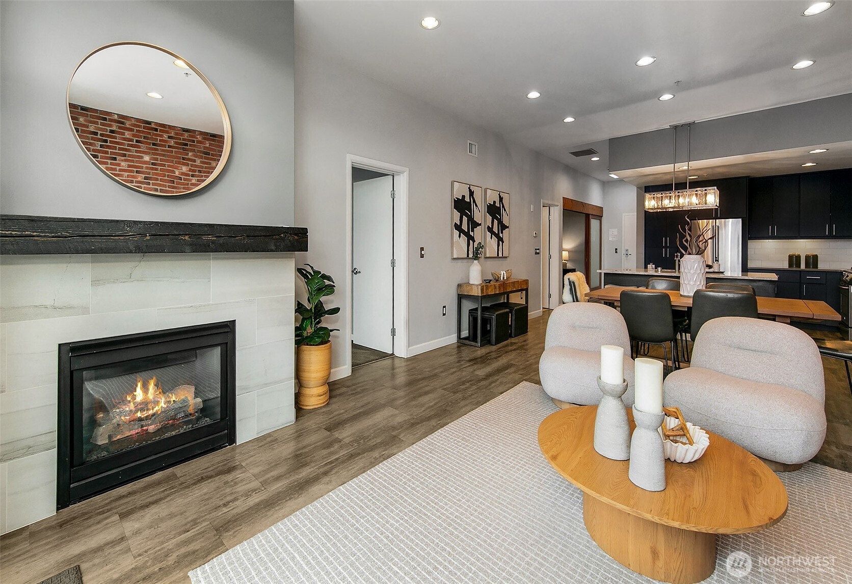 17 West Mercer Street, Unit 302 Seattle, WA 98119 - Photo 11 of 28 a living room with furniture a fireplace and window