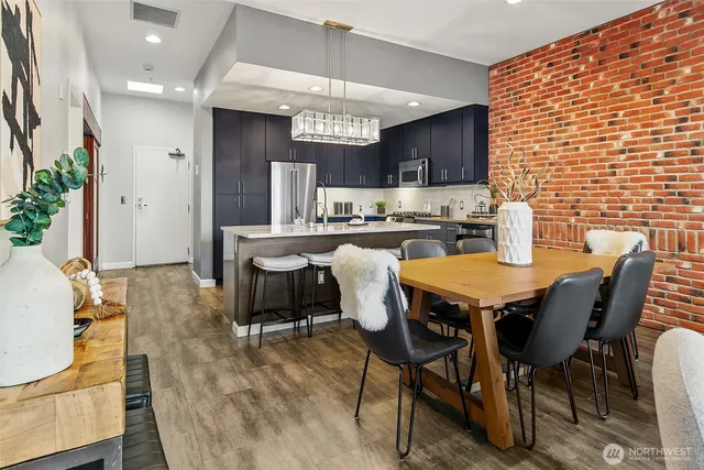 a dining table with chairs and wooden floor